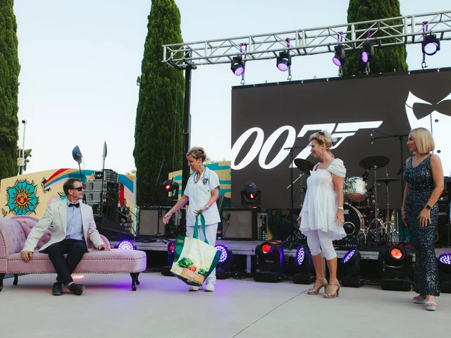 The James Bond-themed opening on the main stage, with 007 reclining on a pink chaise in front of a 007 backdrop