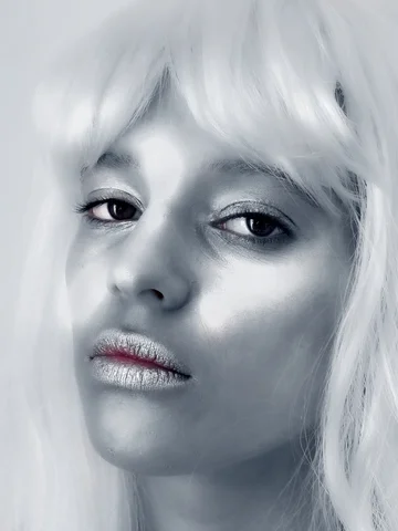 Silver-toned portrait of a girl with a white fringe