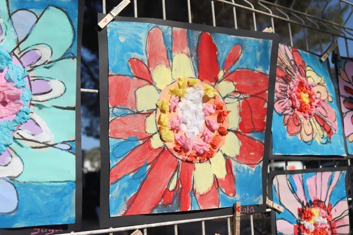 Close-up of a bright Primary flower painting with tissue-paper petals