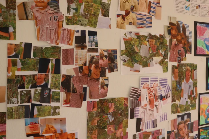 Photo collages pinned across a display wall