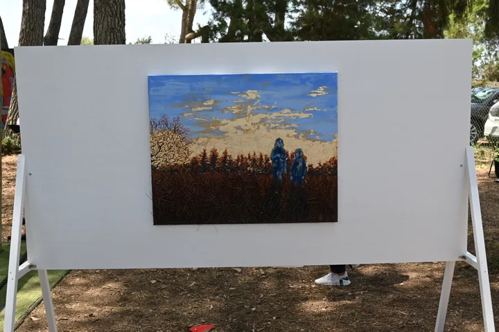 A single landscape painting displayed on a white board