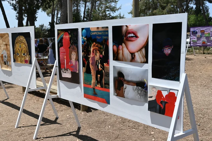Student photography displayed on boards outdoors
