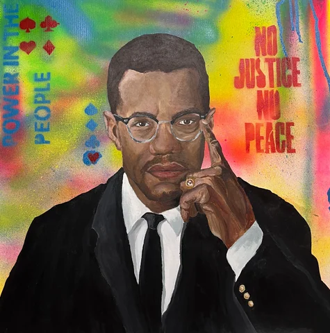 Painted portrait of Malcolm X with the words No Justice No Peace