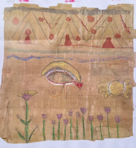 Egyptian-style artwork on brown paper with an eye and lotus flowers