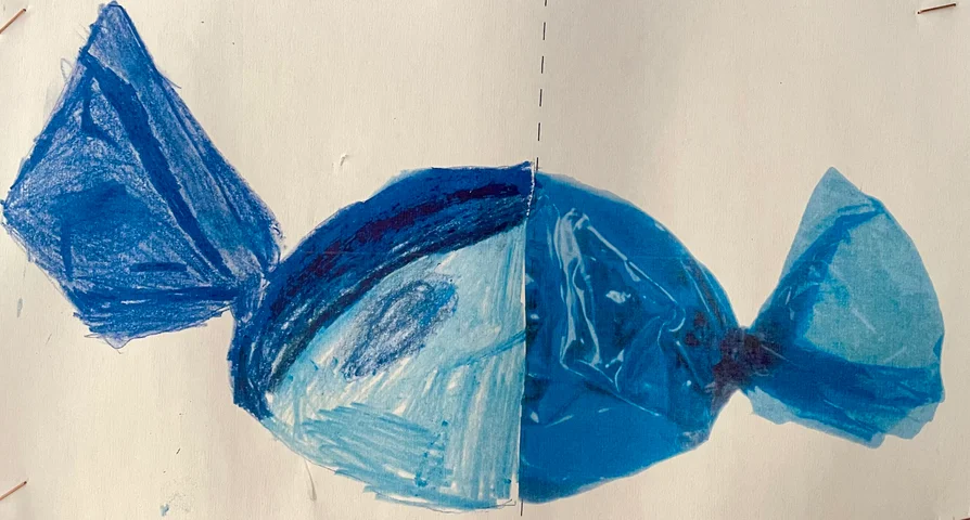 A wrapped sweet made from blue tissue paper and crayon