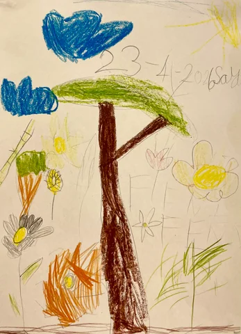 Crayon drawing of a tree with flowers in the grass