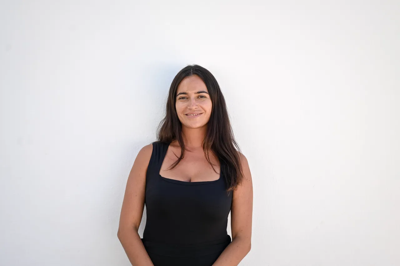 Chiara Kidd, Primary Art & DT Coordinator, standing against a white wall