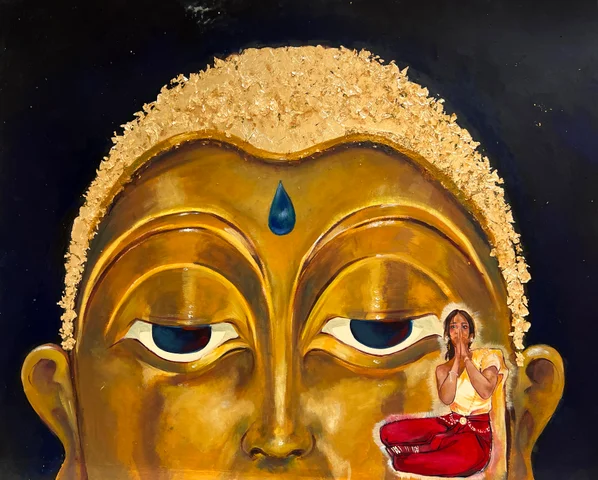 Painting of a golden Buddha face with a small figure on its cheek