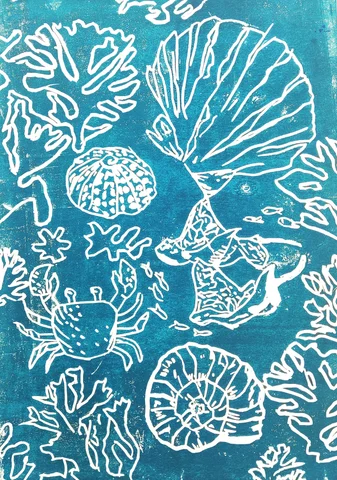 Blue linocut print of shells and coral