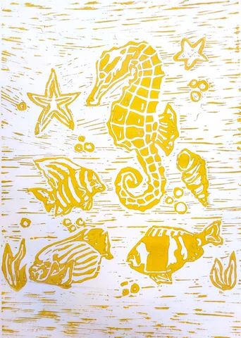 Yellow linocut print of a seahorse and fish