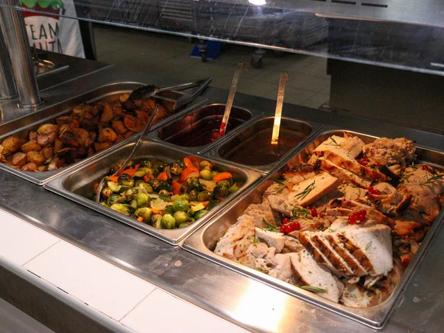 Hot buffet trays of roast vegetables, Brussels sprouts and chicken