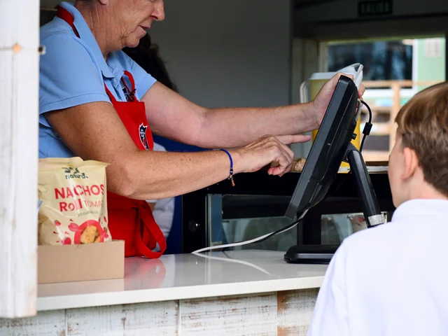 Mari using the till as a pupil pays with their personal code