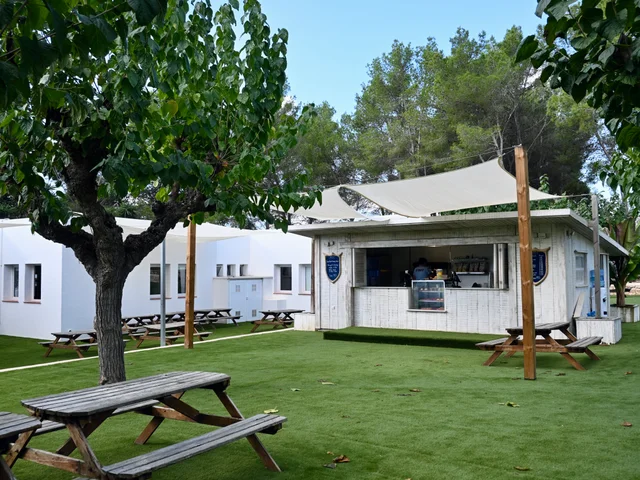 The Snack Shack and picnic benches seen across the grass