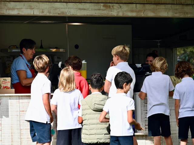 A group of Primary pupils waiting to be served at the counter
