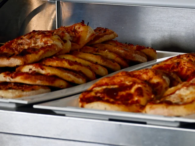 Trays of homemade pizza slices