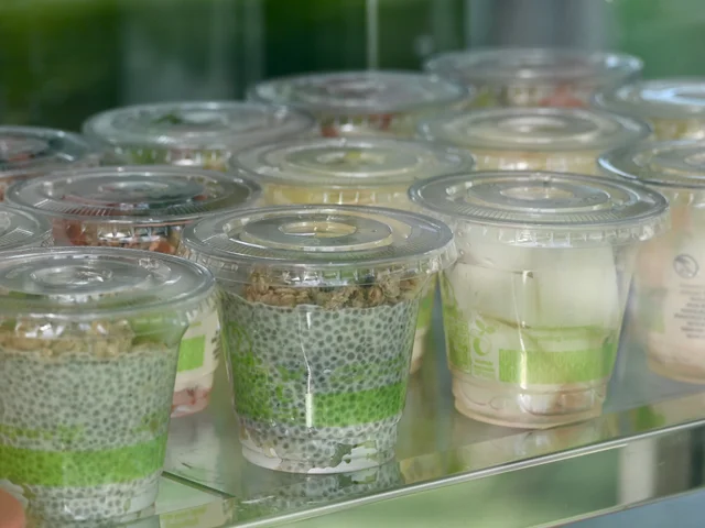 Cups of chia pudding and yoghurt in the chilled cabinet