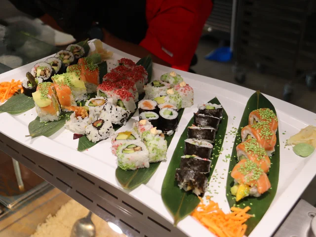 Platter of sushi rolls on banana leaves for Sushi Friday