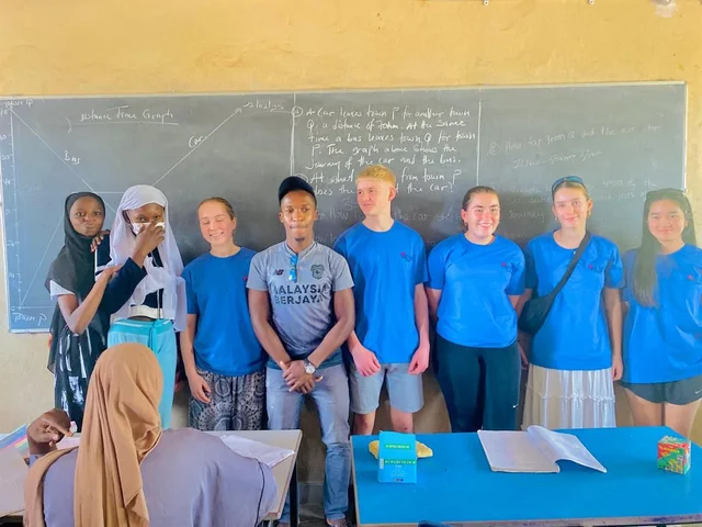 Morna students in a Gambian classroom in front of the blackboard