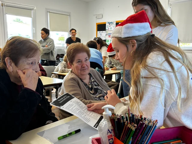 A student and a visiting resident in conversation