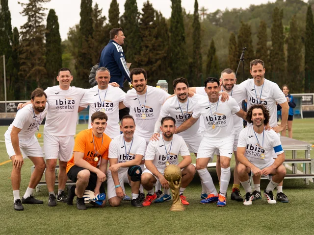 The teachers' team posing with the trophy