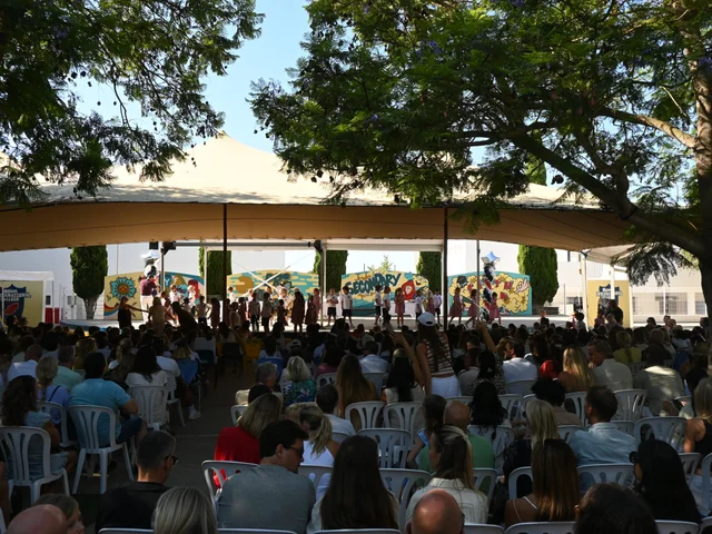 Families seated under the marquee for the end-of-year ceremony