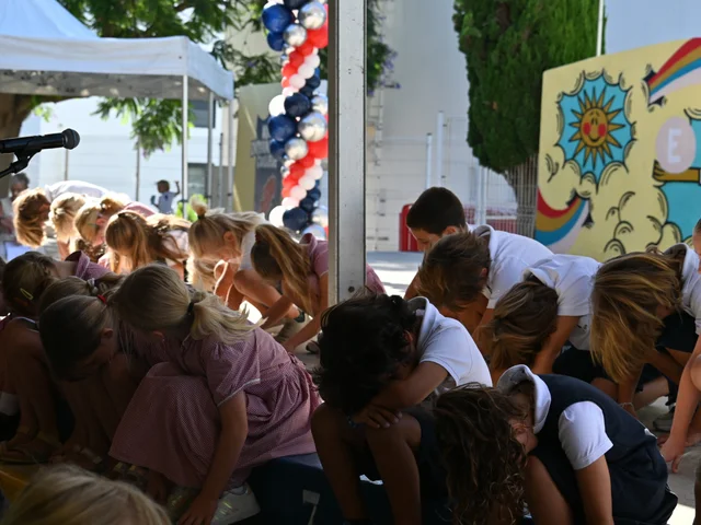 Children taking part in the end-of-year celebration