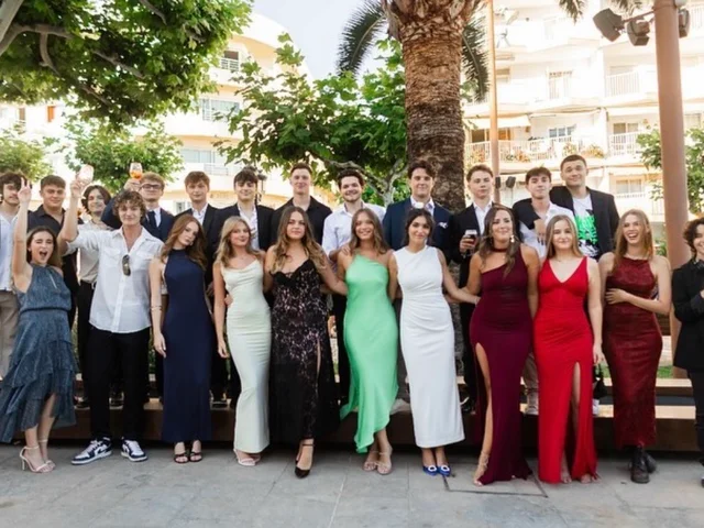The Year 13 class in their prom outfits, lined up for a group photo