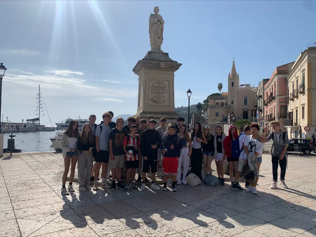 Students gathered on a seafront square in Sicily