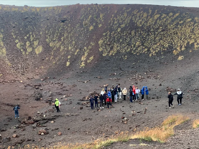 Students crossing a crater on the slopes of Mount Etna