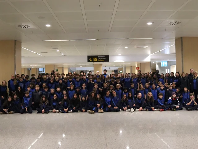 Students and staff from the 2025 ski trip gathered in the airport terminal