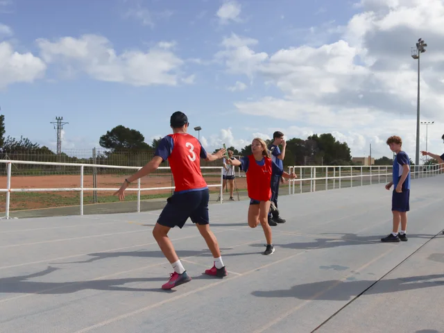 A student taking a run-up during a Sports Day event